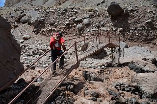19 Agustin Crossing A Metal Bridge Over The Horcones River Before The Final Ascent To Confluencia On The Descent From Plaza de Mulas